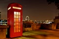 Traditional english phone booth with the London Center in the ba