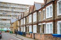 Traditional English terraced houses with council block Aylesbury Estate in the background Royalty Free Stock Photo