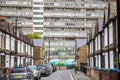 Traditional English terraced houses with huge council block in the background