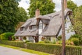 Traditional English, thatched roof cottages seen in a very well maintained condition.