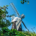 Traditional English windmill against blue sky Royalty Free Stock Photo