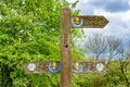 Traditional English wooden public footpath/bridleway/cycleway sign in countryside, Cheshire, UK Royalty Free Stock Photo