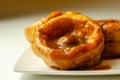 Traditional English Yorkshire pudding with meatballs and thick gravy sauce Royalty Free Stock Photo