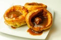 Traditional English Yorkshire pudding with meatballs and thick gravy sauce Royalty Free Stock Photo