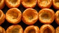 Traditional English Yorkshire pudding side dish on black rustic background Royalty Free Stock Photo