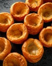 Traditional English Yorkshire pudding side dish on black rustic background Royalty Free Stock Photo