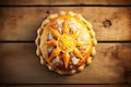 Traditional epiphany cake, also known as kings day bread, on a wooden background