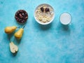 Milk and granola. Traditional european breakfast. Muesli, dates and fresh pears