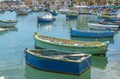 The traditional eyed boats in the harbor of fishing village Marsaxlokk in Malta Royalty Free Stock Photo