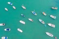 Traditional eyed colorful boats in the harbor of Mediterranean fishing village, aerial view Marsaxlokk, Malta Royalty Free Stock Photo