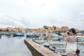 Traditional eyed colorful boats Luzzu in the Harbor of Mediterranean fishing village Marsaxlokk, Malta Royalty Free Stock Photo