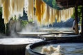 Traditional Fabric Drying Process in Outdoor Workshop