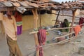 CHITTORGARH, RAJASTHAN, INDIA - DECEMBER 13, 2017: A traditional farm in the countryside of Chittorgarh with a woman cooking in th