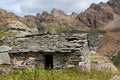 Traditional farmhouse in rough mountain landscape