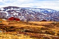 Traditional farmhouse at the foot of the mountain, Norway Royalty Free Stock Photo