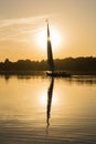 Traditional felluca sailing boat silhouette at sunset Royalty Free Stock Photo