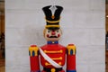 Traditional figurine christmas nutcracker wearing an old military style in Red Uniform Royalty Free Stock Photo