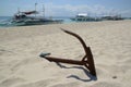 A traditional Filipino boat or Outrigger at Island on sunny day and anchored on a sandy be