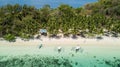 Traditional filipino boats located in a tropical beach with palm trees and white sand in a sunny day. Travel destination in The Royalty Free Stock Photo