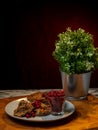 Traditional Finnish cuisines closeup of a liver caseroll dish on a plate with fresh lingonberries on the side