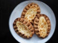 Traditional Finnish Karelian pies on a plate with black background