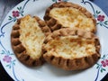 Traditional Finnish Karelian pies on a plate with black background