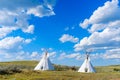 Native Teepees in a grassland Royalty Free Stock Photo