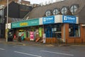 A traditional fish and chip shop and a Centra supermarket open for business on a cool spring even