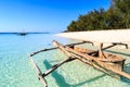 Traditional fisherman boat lying near the beach in clear water Royalty Free Stock Photo