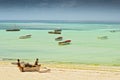 Traditional fisherman boats on the beach on tropical island Zanzibar, Tanzania Royalty Free Stock Photo