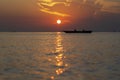 Traditional fisherman dhow boat during sunset on Indian ocean in island Zanzibar, Tanzania,  Africa Royalty Free Stock Photo