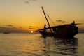 Fisherman dhow boat during sunset on Indian ocean in island Zanzibar, Tanzania, East Africa Royalty Free Stock Photo
