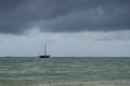 Traditional fisherman dhow boat during sunset on Indian ocean in island Zanzibar, Tanzania, East Africa Royalty Free Stock Photo