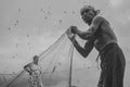 a Traditional fisherman with fishing net.