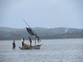 Traditional fishermen fishing pulling a raditional dhow in Mozambique