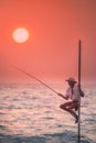 Traditional fishermen at the sunset, Sri Lanka.