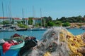 Traditional fishery harbor in greece with multiple colourful fish nests