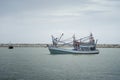 Traditional fishing boat laying on the sea.cloudy sky.filtered image.selective focus.