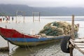 Traditional fishing boat in oyster farming industry in Lap An Lagoon, Vietnam Royalty Free Stock Photo