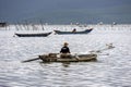 Traditional fishing boat in the oyster farming industry in Lap An Lagoon, Vietnam Royalty Free Stock Photo