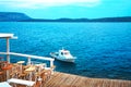 Traditional fishing boat in turquoise water of the Aegean Sea on the coast of the port town Ermioni, Greece Royalty Free Stock Photo