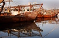 Traditional fishing boats called as dhow parked in the Fishing harbor of Manama, Bahrain Royalty Free Stock Photo