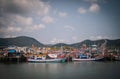 Traditional fishing boats dock at Bang Saray Pier, Sattahip District, Thailand