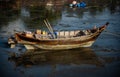 Traditional fishing boats stranded on the beach at low tide at Ban Bang Phra Traditional Fishing Pier, Chonburi Province