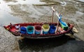 Traditional fishing boats stranded on the beach at low tide at Ban Bang Phra Traditional Fishing Pier, Chonburi Province