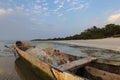 Traditional fishing canoe at the beach in the island of Orango at sunset, in Guinea Bissau