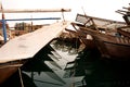 Traditional fishing dhows and reflection, harboured at Manama, Bahrain