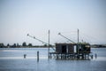 Traditional fishing hut on stilts with suspended nets in Comacchio valley, Emilia Romagna, Italy. Royalty Free Stock Photo