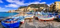 Traditional fishing village Aspra with colorful boats in Sicily.