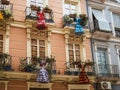 Traditional flamenco dance dresses costumes hanging on a spanish andalusian house balcony facade in MÃÂ¡laga Royalty Free Stock Photo